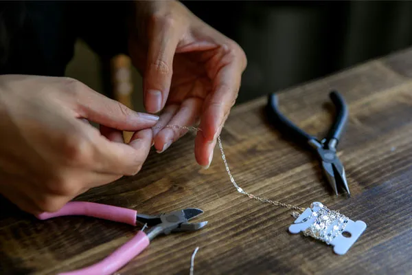 Repairing a necklace at a Fine Jewelry store