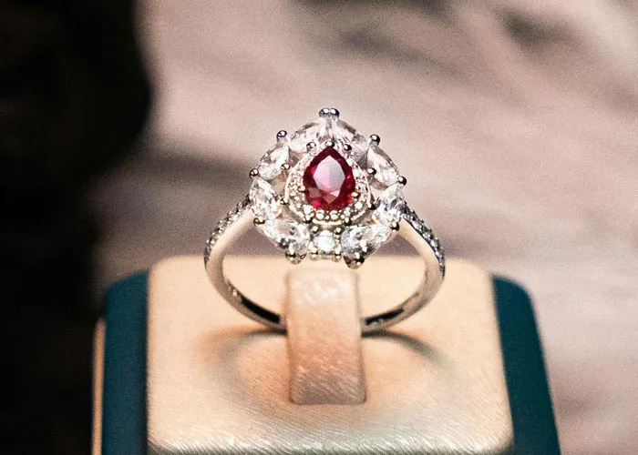 A ruby diamond engagement ring ready for pickup after an excellent jewelry repair service