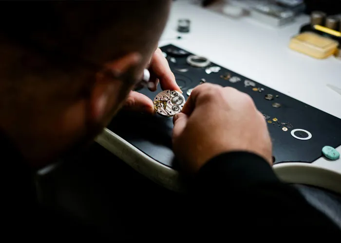 Repairing a watch by master jewelers