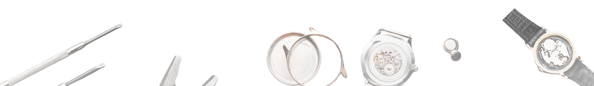 Disassembled wristwatch with tools and parts