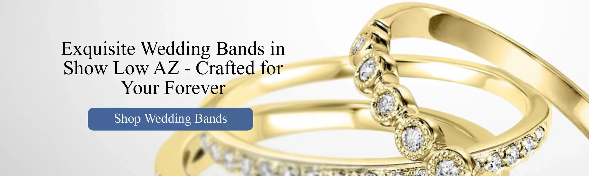Elegant yellow gold wedding bands with round-cut diamonds, featuring intricate pavé and bezel settings. Luxury bridal jewelry banner for Helmut the Jeweler in Show Low, AZ