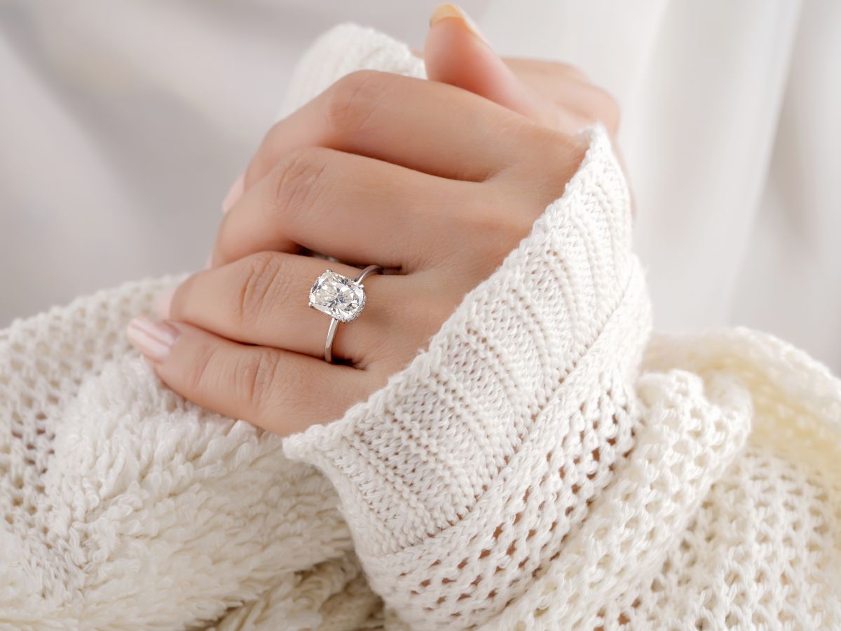 Close-up of hand wearing silver diamond ring
