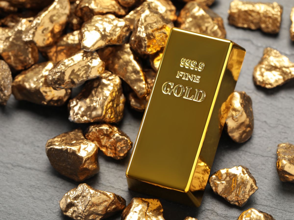 999.9 fine gold bar surrounded by raw gold