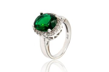 Round emerald ring with diamond accents side view