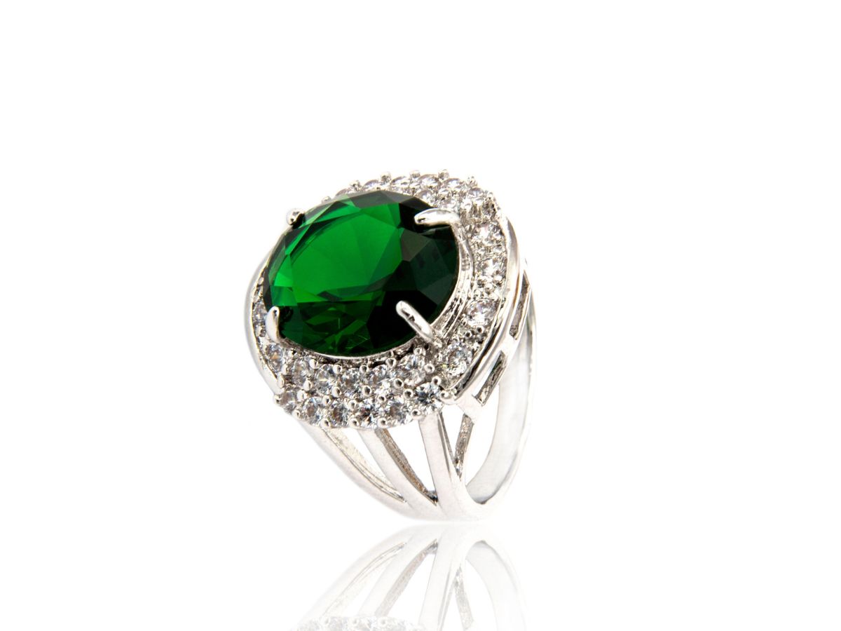 Statement emerald ring with diamond halo band