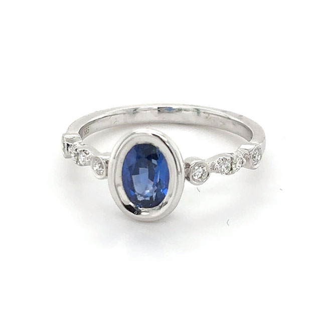 Oval sapphire ring with diamonds on white gold band