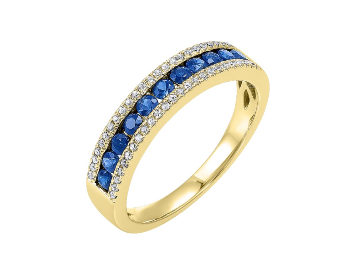 Yellow gold wedding band with sapphire gemstone set in pavé diamond accents