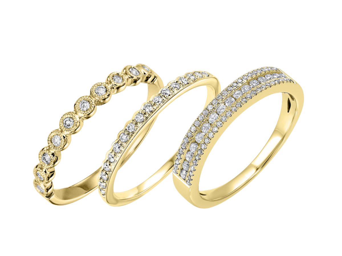 Set of three yellow gold diamond wedding bands in unique styles