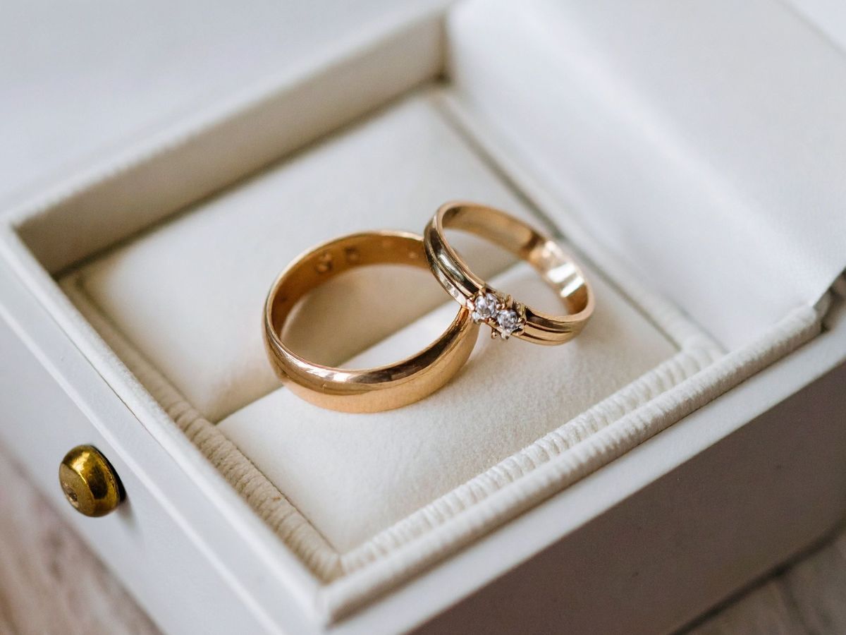 Diamond and gold wedding rings in velvet ring box