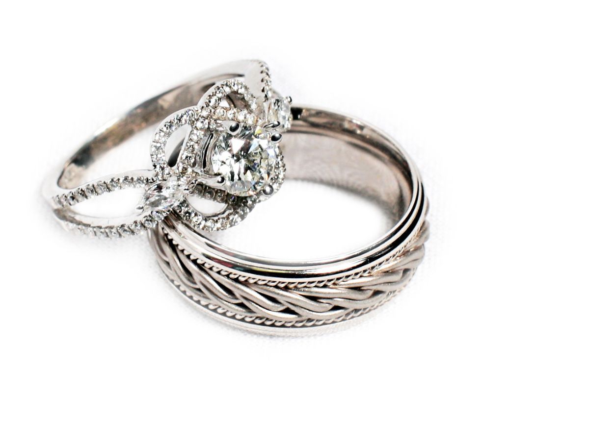 Vintage silver wedding band design with diamond accent rings.