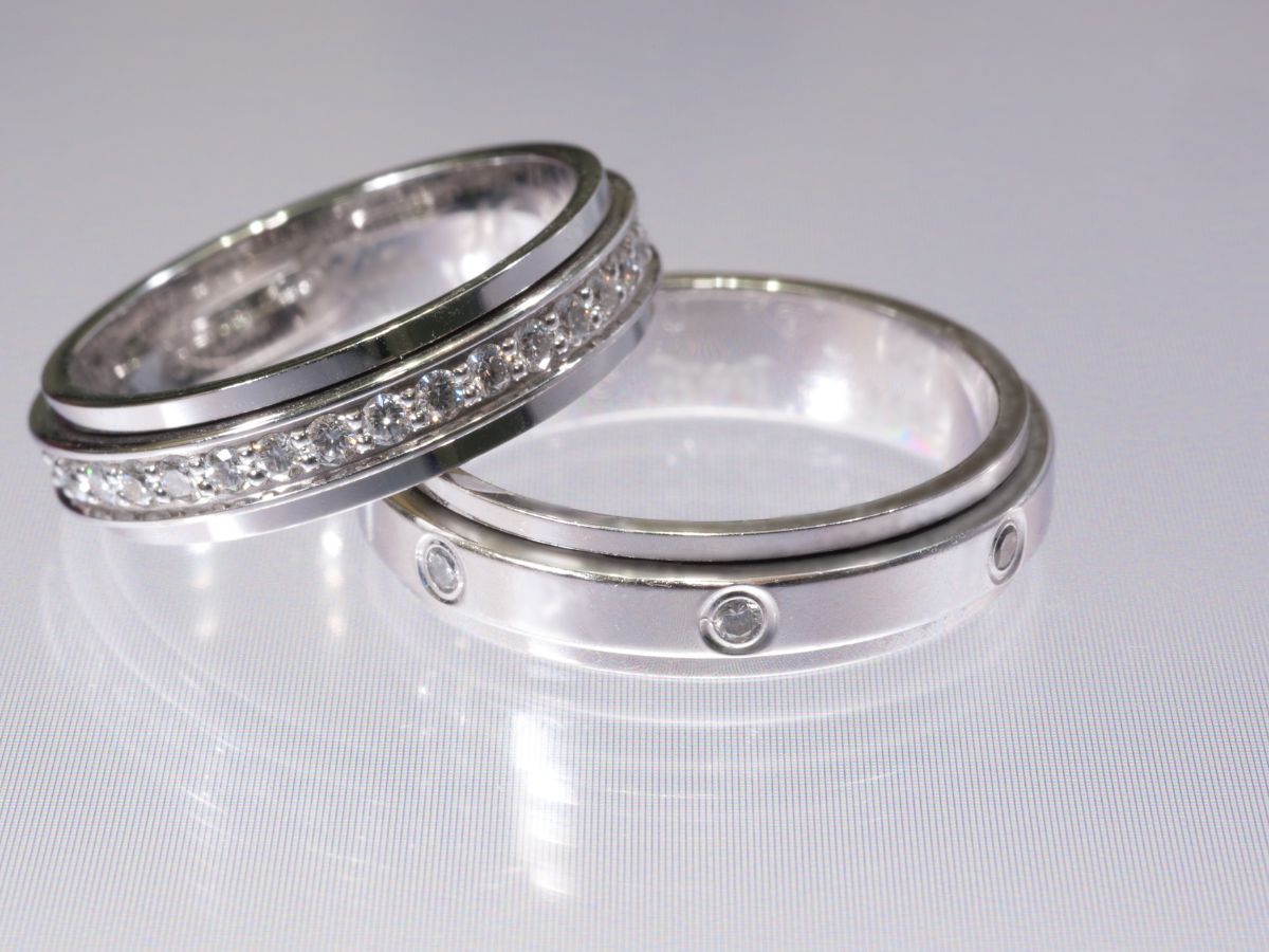 Silver vintage wedding bands with diamond accents.