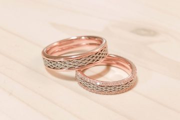 Elegant rose gold wedding rings with intricate diamond detailing