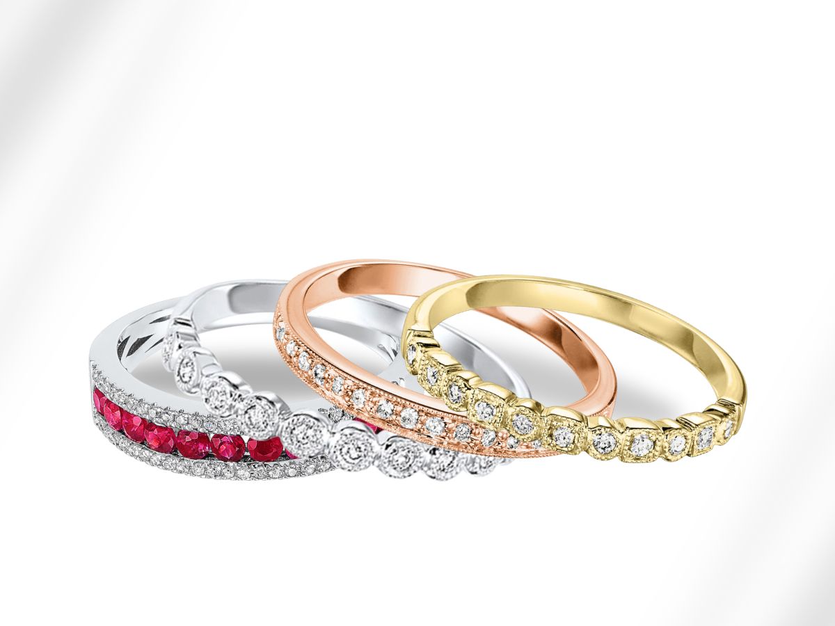Elegant ruby, diamond, and gold rings stacked in modern style
