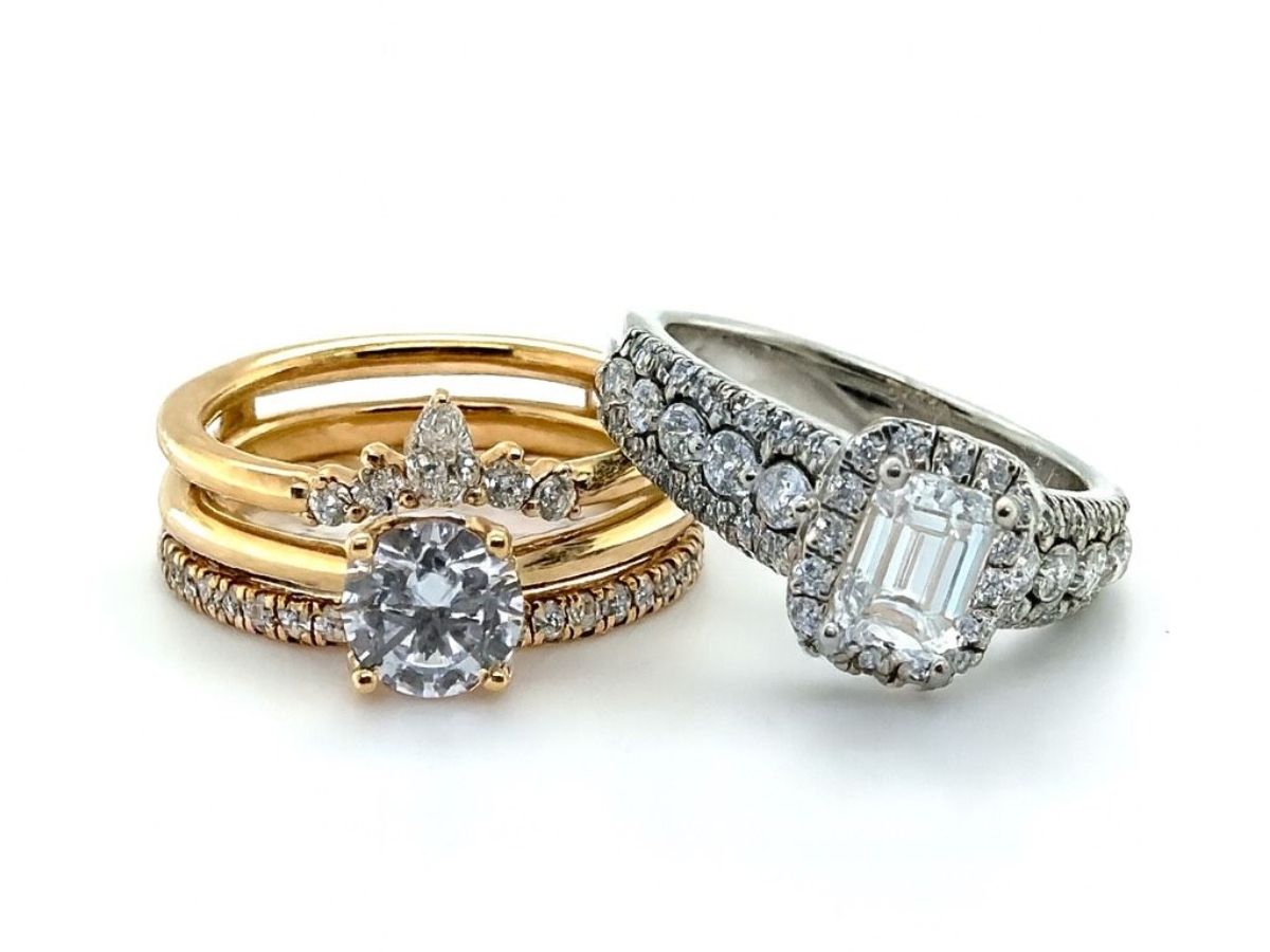 Gold and silver diamond rings with crown-like designs