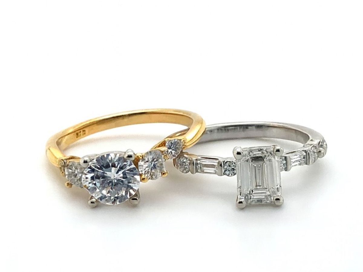 Gold and platinum diamond rings with side stones
