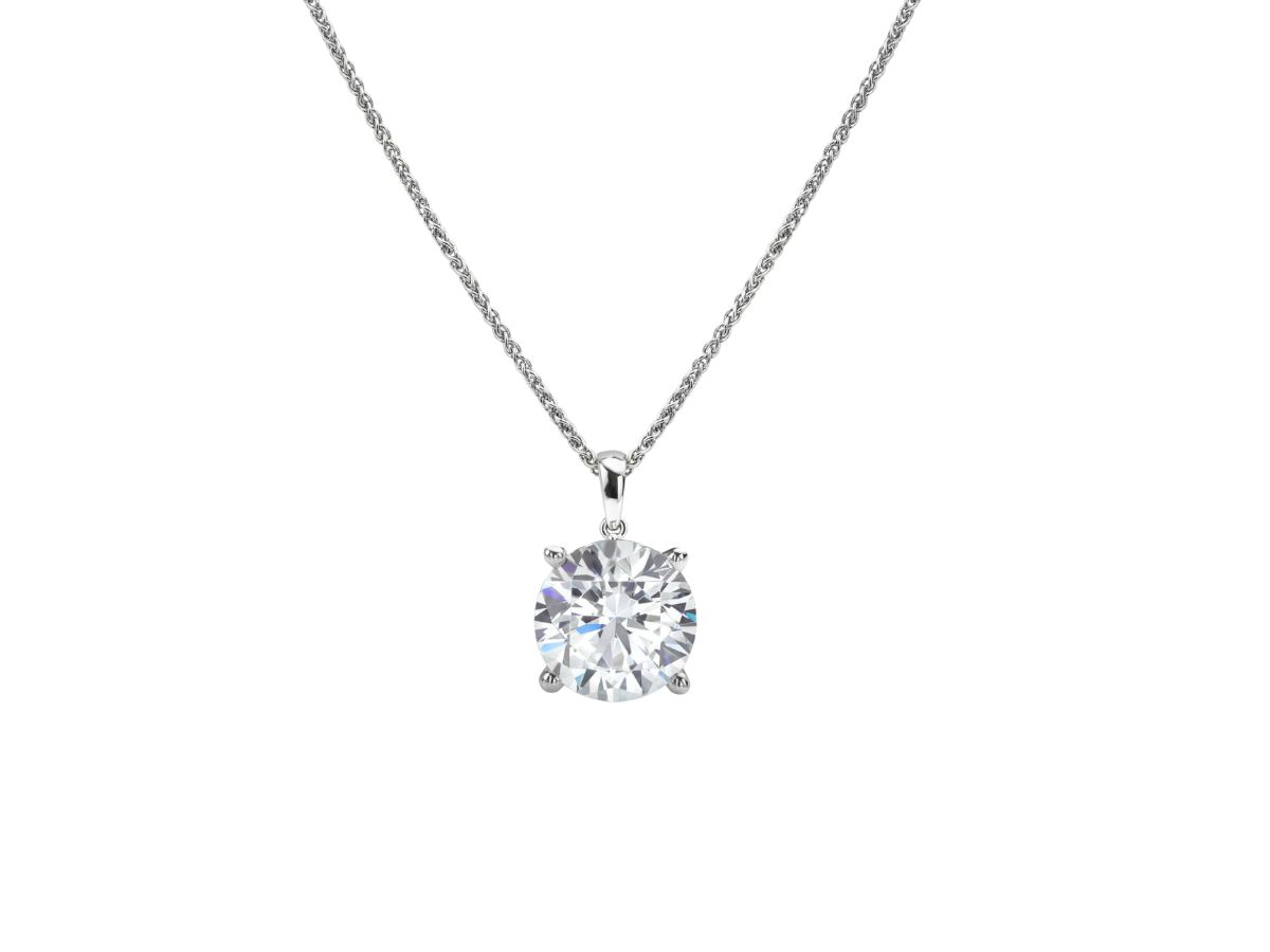 Silver chain necklace with single large round-cut solitaire diamond pendant.