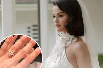 Selena Gomez wearing a white dress, showcasing her marquise diamond engagement ring.