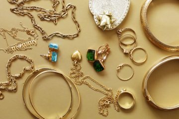 Assorted gold jewelry set with rings, chains, and bangles