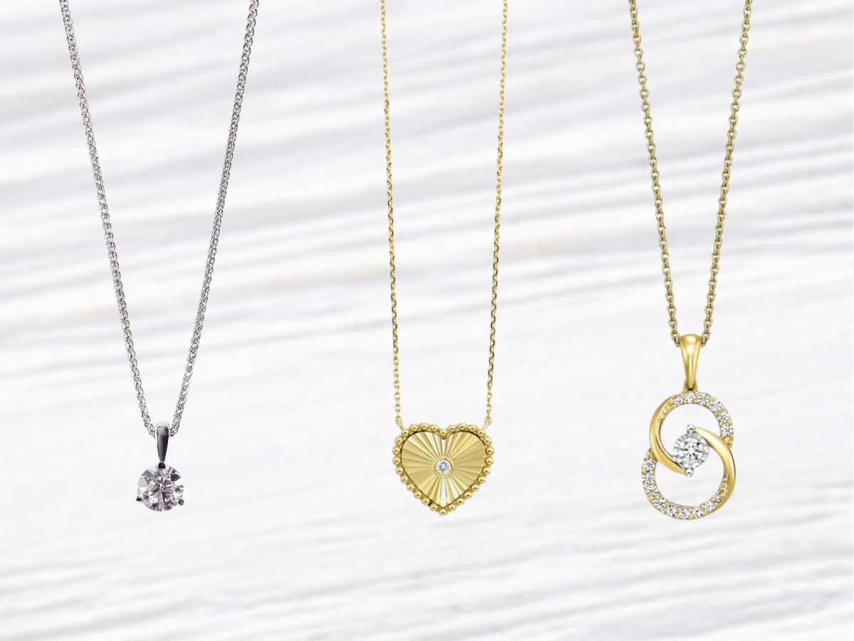 Close-up of minimalist pendant necklaces in various elegant designs.