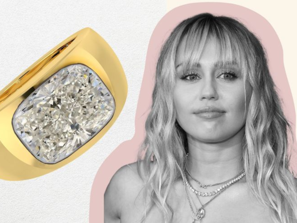 Cushion cut diamond bezel set gold engagement ring next to Miley Cyrus.