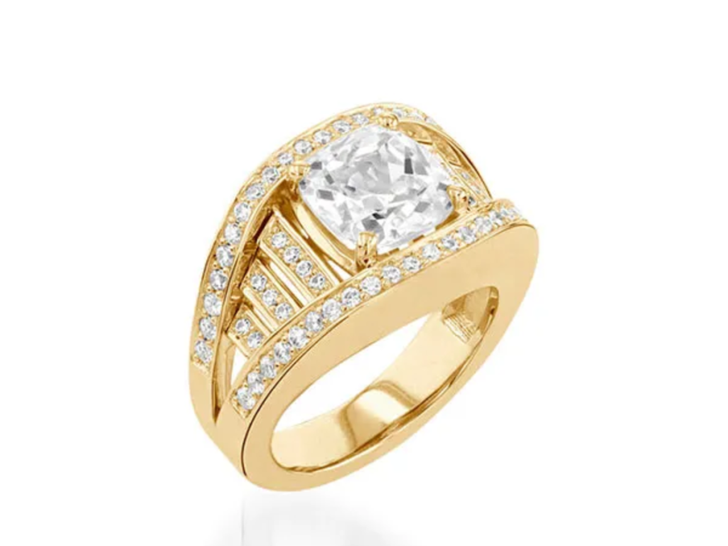 Gold statement ring with cushion diamond