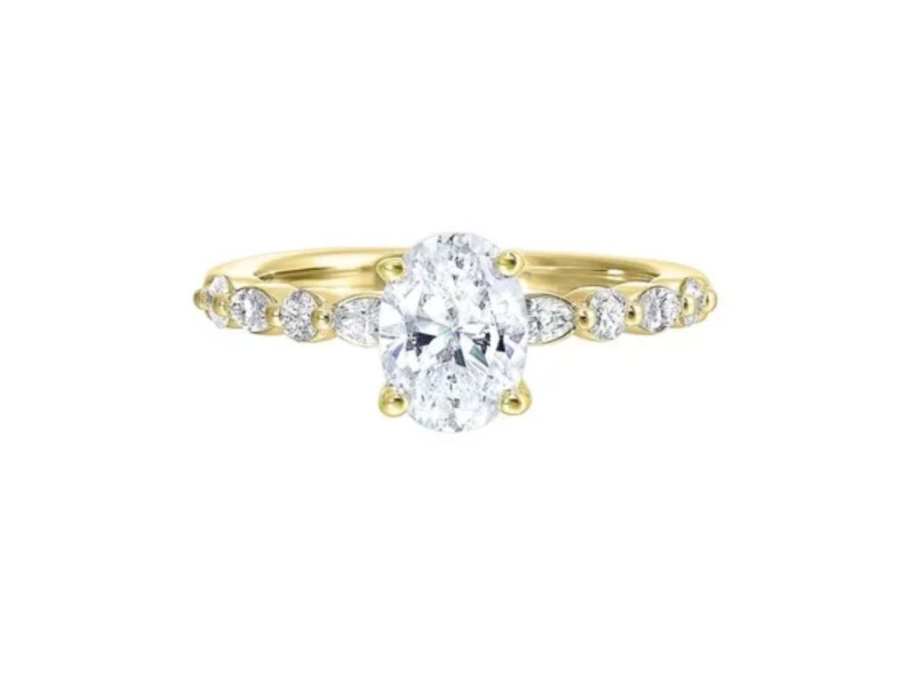Oval diamond ring with pear side stones