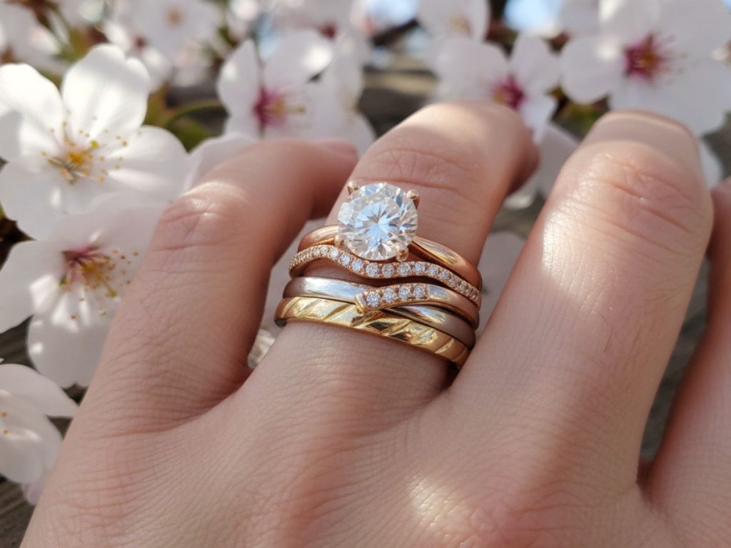 Oval cut diamond ring on finger