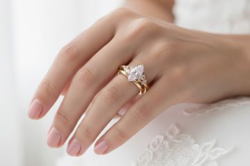 Oval diamond solitaire engagement ring worn