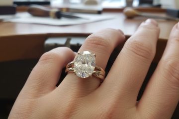 Oval diamond engagement ring on hand