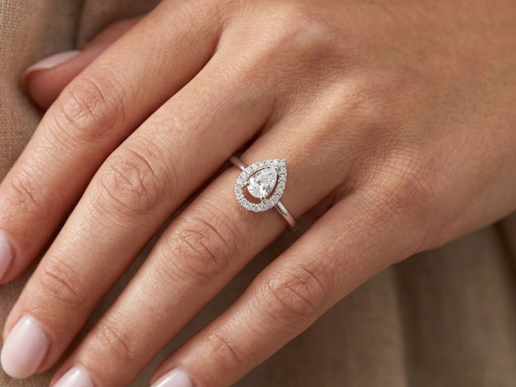 Pear shape diamond halo engagement ring