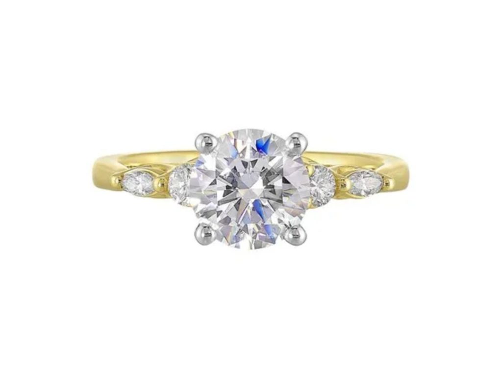 Yellow gold three stone diamond ring