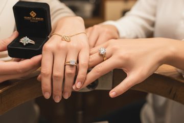 Diamond engagement rings couple hands display