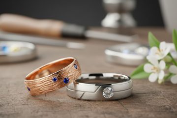 Two-tone wedding bands with sapphire and diamond accents