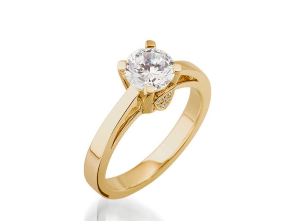 Gold solitaire diamond engagement ring closeup