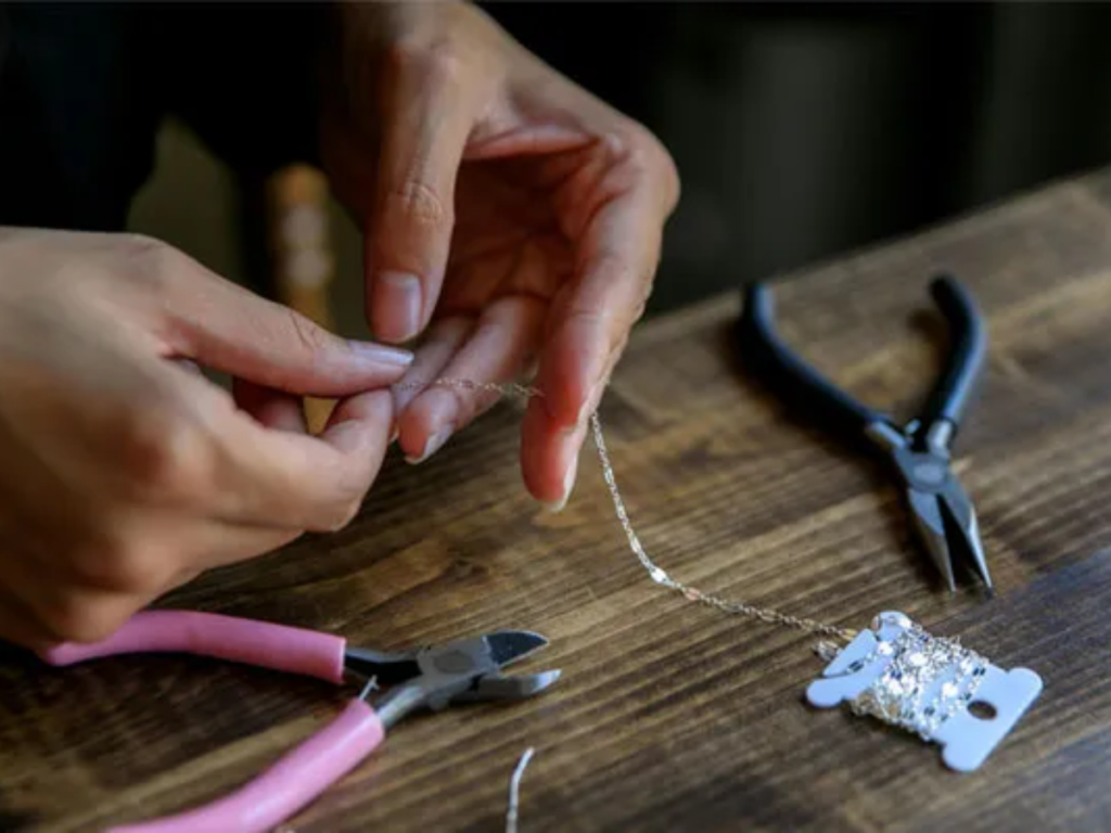 Handmade jewelry wire wrapping with crafting tools