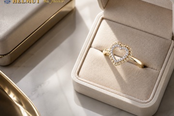 Gold heart diamond ring in a cream jewelry box