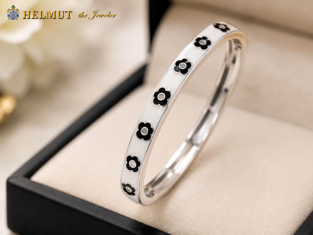Black floral enamel bracelet in jewelry box