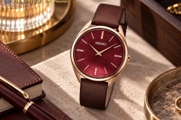 Red dial Seiko watch with brown leather strap