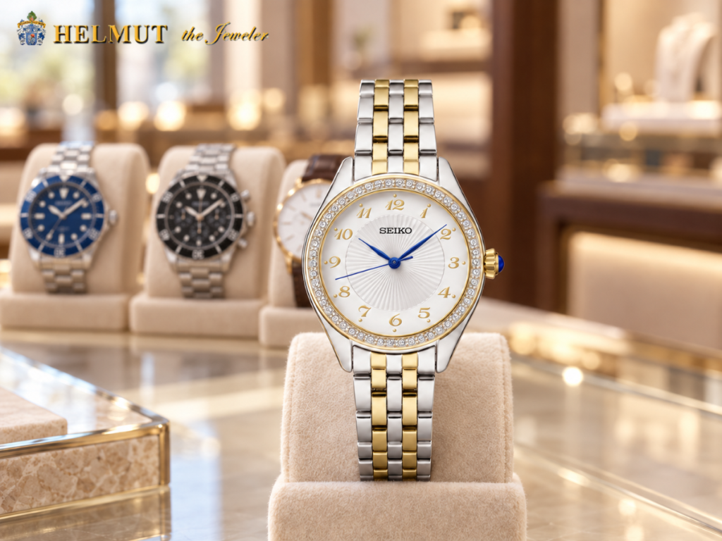 Two-tone Seiko watch with crystal bezel displayed in a jewelry store
