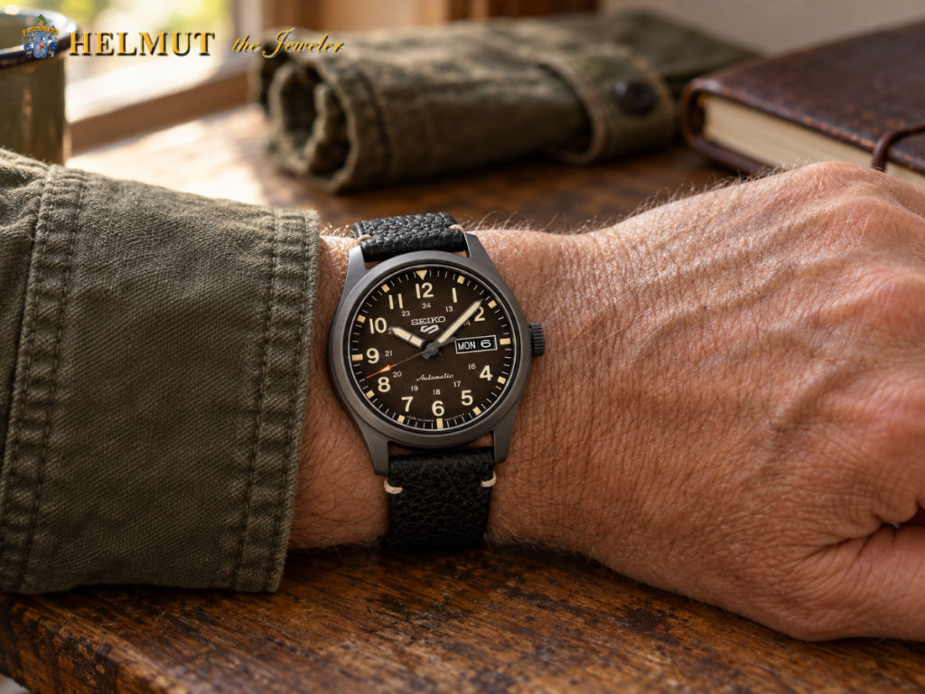 Black dial Seiko field watch worn with military jacket