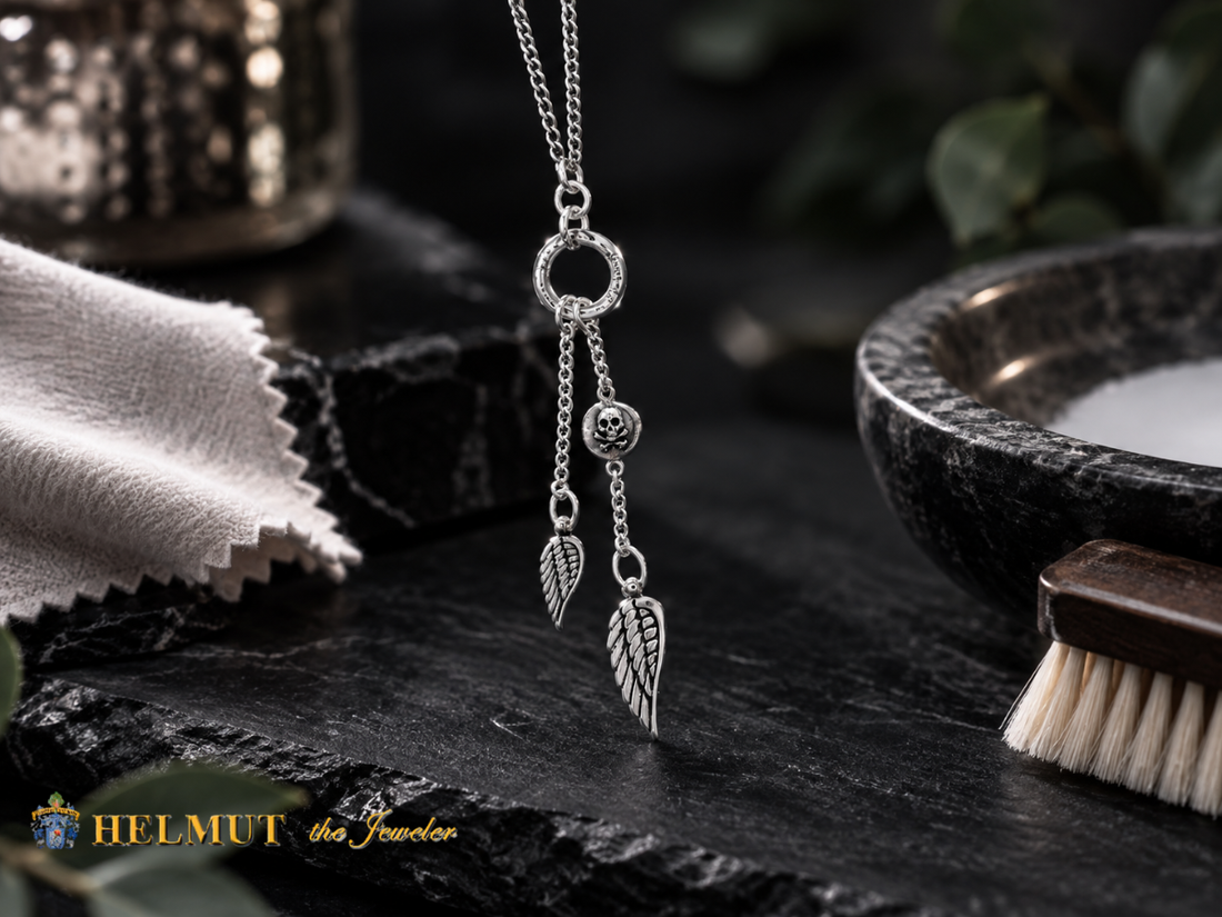 Silver wing charm necklace display