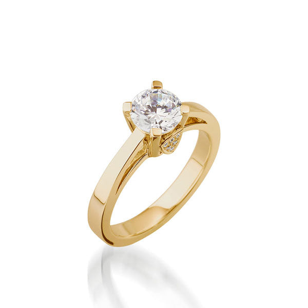 Gold solitaire engagement ring with round-cut diamond centerpiece