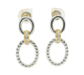 A pair of silver-toned drop earrings with a thick textured oval pendant, a smaller circular ring above it, and a small gold-toned accent section set with clear stones.