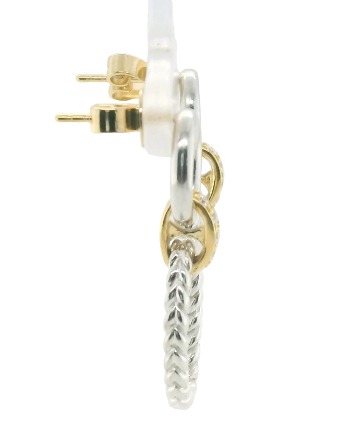 A close-up side view of a silver huggie hoop earring with a textured drop charm and gold post, shown on a white background.