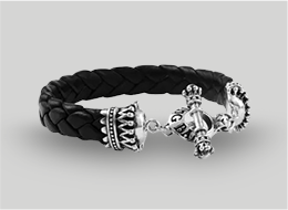 Black braided leather bracelet with silver clasp on a light gray background