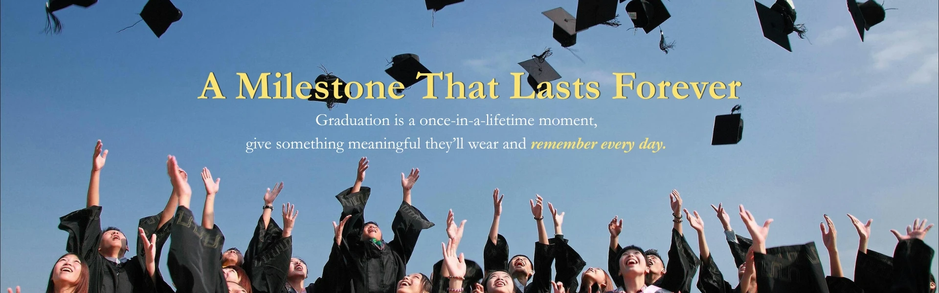 Graduates celebrating by tossing caps in the air with banner promoting meaningful graduation gifts and jewelry that lasts a lifetime